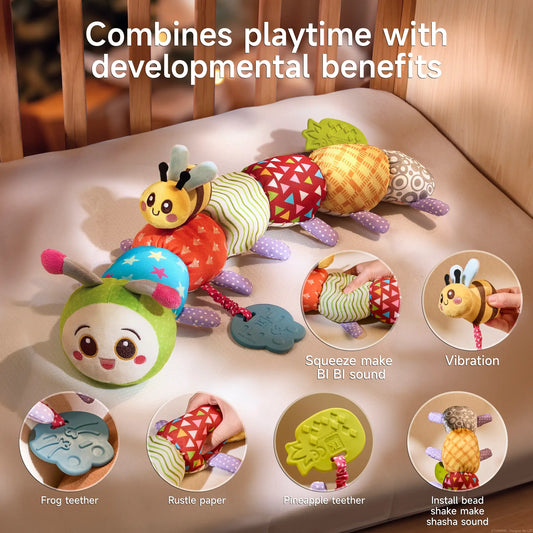 Colorful patchwork caterpillar plush toy laid across a crib rail, featuring a frog-shaped teether, pineapple teether, rustling fabric segments, a vibrating bee attachment, and built-in bead shaker to stimulate baby’s senses and promote developmental play