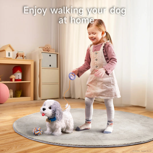 Smiling young girl walking a realistic plush toy dog with a leash-shaped remote control on a rug in a cozy living room; the toy dog has fluffy white and gray fur, a blue collar, and a ball toy nearby.