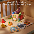Montessori tissue box toy set with colorful cloth tissues, soft fruit squeeze toys, and animal-themed cloth cards displayed in a crib, ideal educational and entertaining gift for children.