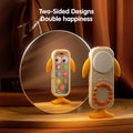 A whale-shaped baby toy phone with blue fins and tail floating above an open glowing book, surrounded by illuminated numbers and English words for numbers. Text at the top reads “Chinese-English bilingual vocalization, digging out language talent.”