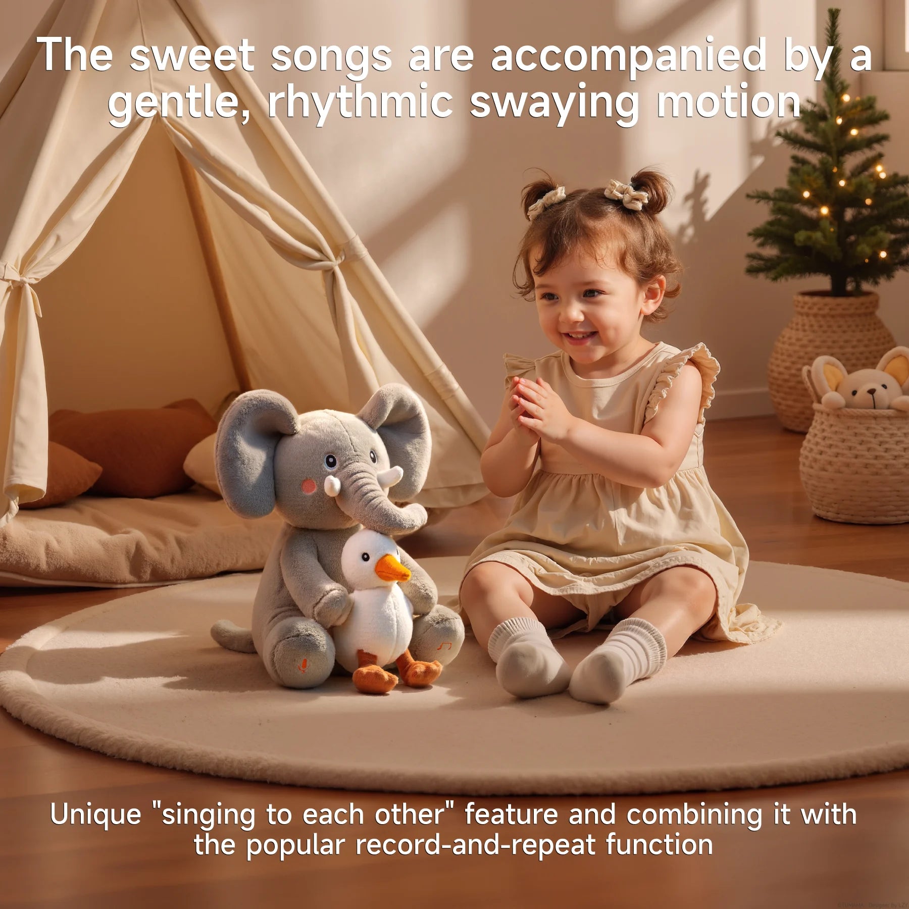 A smiling toddler in a beige dress sits on a round rug in a warmly lit room, clapping joyfully while facing a plush interactive elephant toy that holds a duck. The text above reads, “The sweet songs are accompanied by a gentle, rhythmic swaying motion,” and below, “Unique 'singing to each other' feature and combining it with the popular record-and-repeat function.”