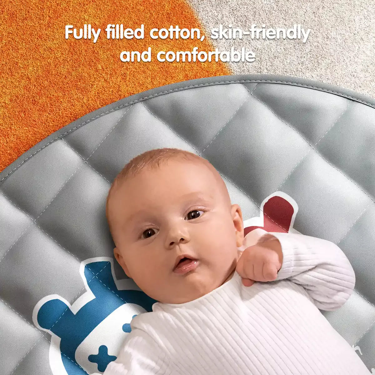 Baby lying on soft grey quilted play mat filled with cotton, designed to be skin-friendly, safe, and comfortable.