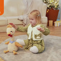 little girl plays with this stuffed chick toy taht wriggles and retells