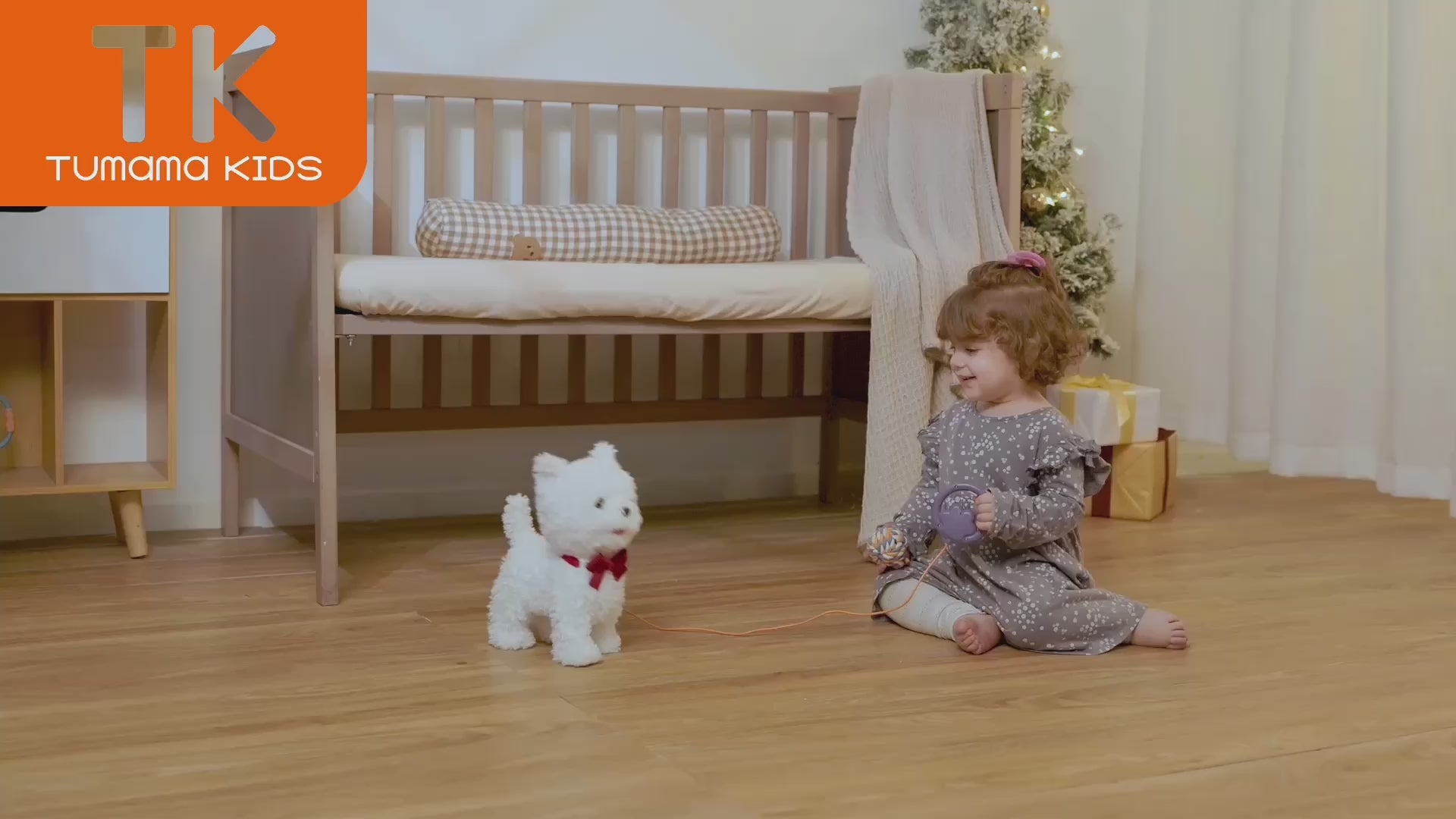 little girl playing with battery operated toy dog that walks and barks